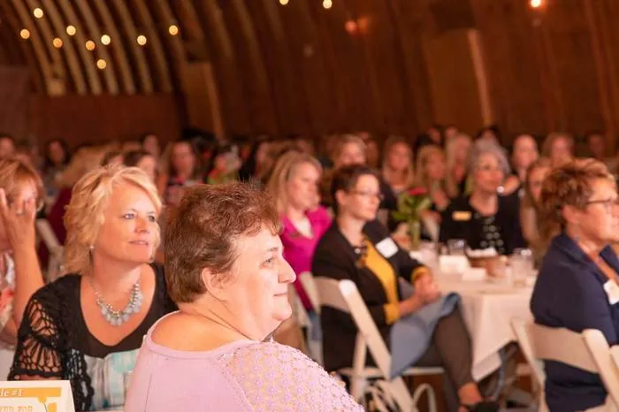 Crowd seated and listening at a Women in Business event